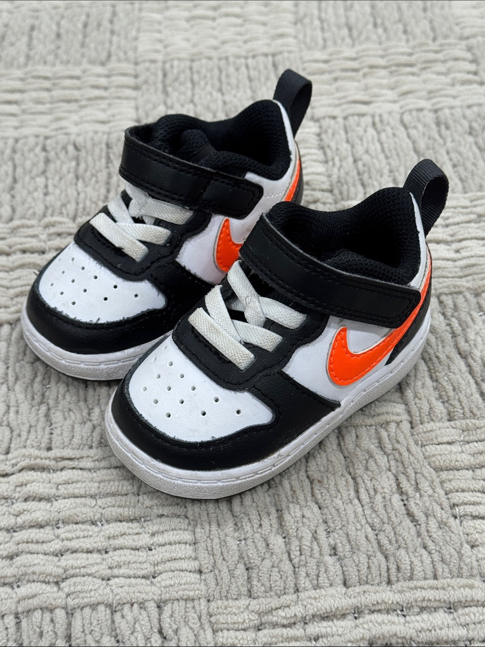 Nike Kids Black & White Sneakers with Orange Swoosh Accent